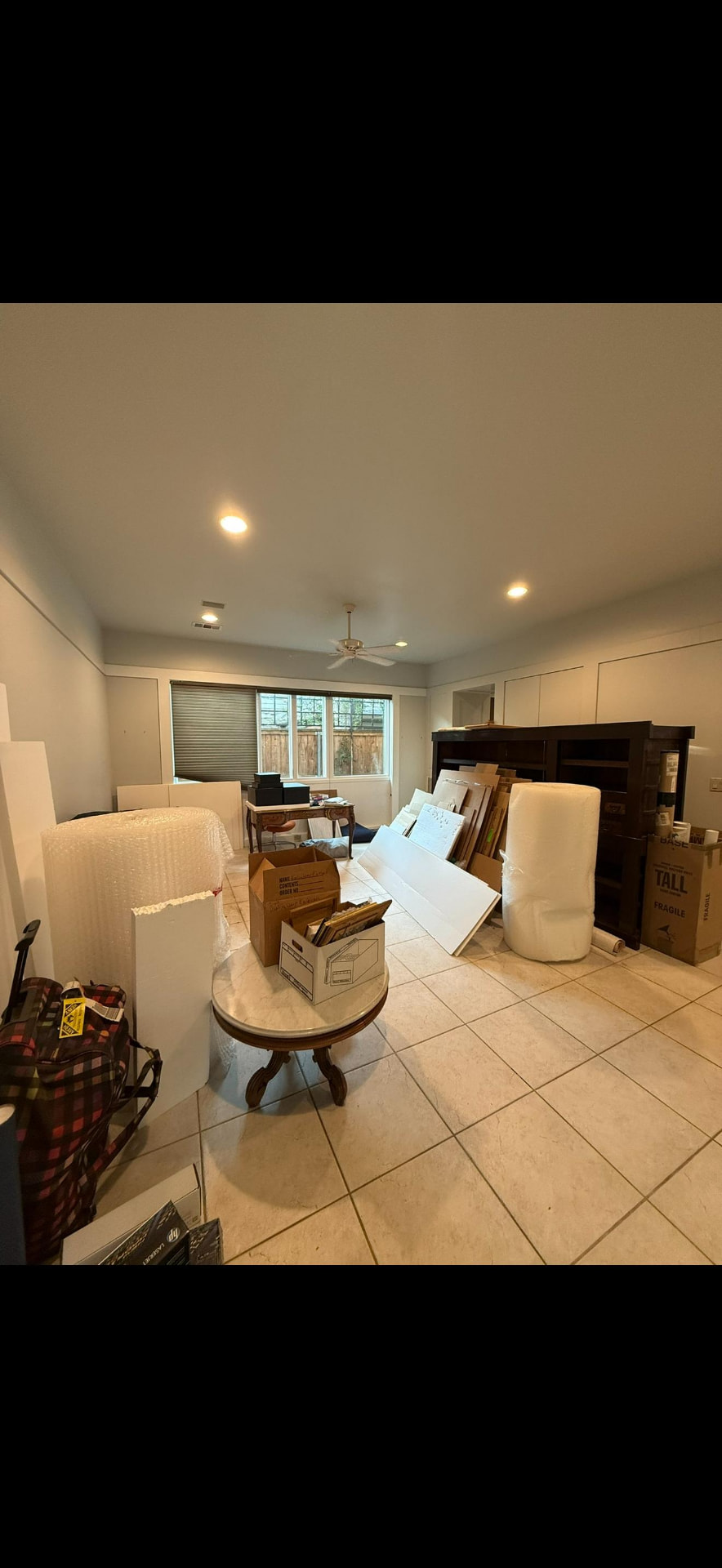 Ground floor living room cleared for renovation with tile flooring